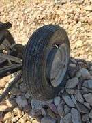 PULL BEHIND SEED/FERTILIZER SPREADER. BAD TIRES.