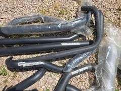BLACK MOTORCYCLE EXHAUST PARTS.