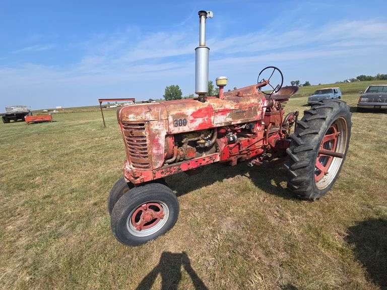 FARMALL 300. 12V CONVERSION. RUNS AND OPERATES GOOD. PTO. ONE REAR TIRE SHOWING SOME WEATHER, OTHER REAR TIRE IS ALMOST NEW, BUT SHOWING SOME WEATHER.