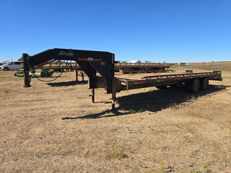 DELTA GOOSENECK TRAILER.  8' WIDE X 23' LONG AND A 5' BEAVERTAIL. RAMPS. ALL 8 TIRES ALMOST NEW. 1 NEW LEAF SPRING. HAY RACKS ***SELLS WITH TITLE***