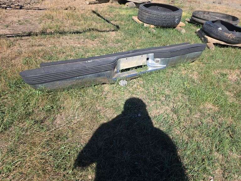 CHROME REAR BUMPER, DENTED.