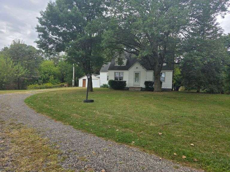 7 +/- Acres Home with Outbuildings