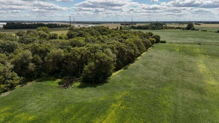 7 +/- Acres Home with Outbuildings