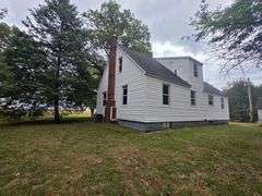 7 +/- Acres Home with Outbuildings