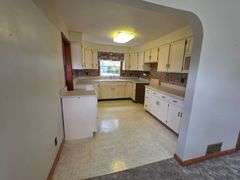 7 +/- Acres Home with Outbuildings