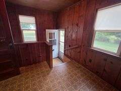 7 +/- Acres Home with Outbuildings