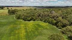 7 +/- Acres Home with Outbuildings