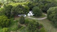 7 +/- Acres Home with Outbuildings