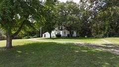 7 +/- Acres Home with Outbuildings