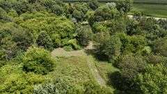 7 +/- Acres Home with Outbuildings