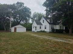 7 +/- Acres Home with Outbuildings