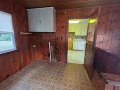 7 +/- Acres Home with Outbuildings