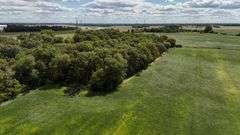 7 +/- Acres Home with Outbuildings