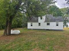 7 +/- Acres Home with Outbuildings