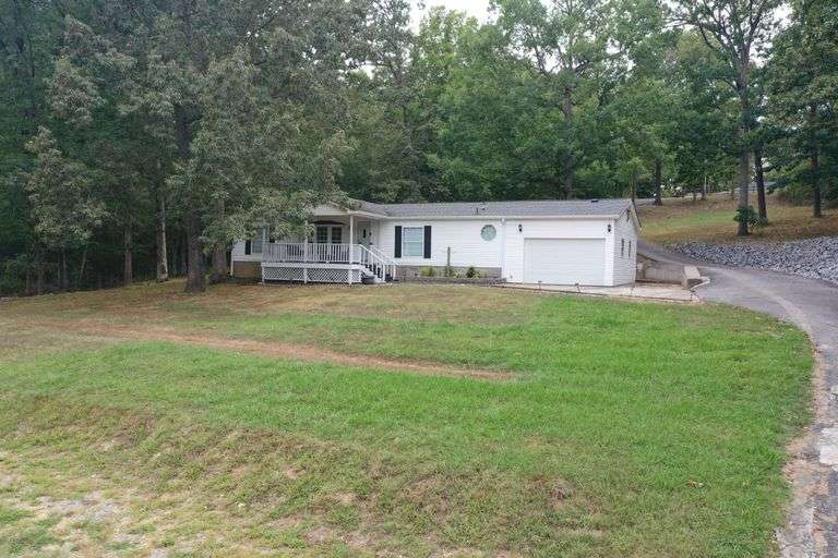 HOME ON STEAMBOAT RD ON PRIVATE LAKE IN GILBERTSVILLE KY
