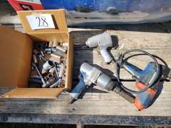 Pneumatic and electric ratchets and box of sockets.