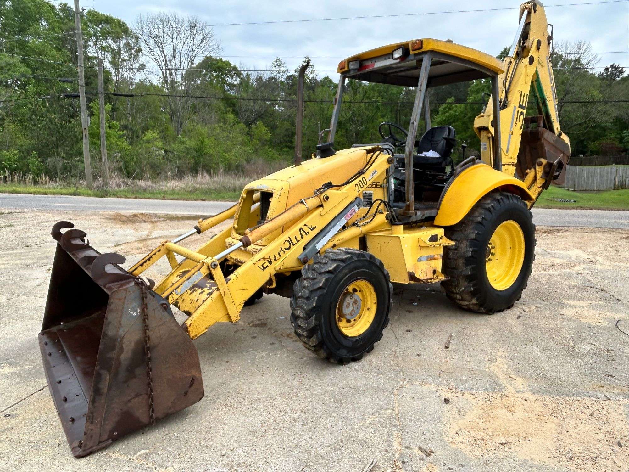 New Holland 555E R/T Loader Backhoe (4,263 Hours) - JJ Merchant LLC