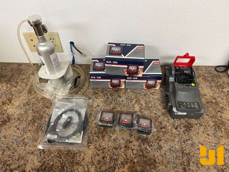 3 UNUSED RKI GX-3R GAS DETECTORS W/CALIBRATION STATION