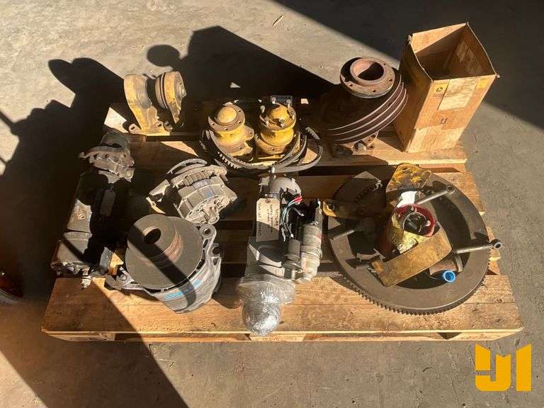 PALLET OF MISC PARTS INCLUDING FLYWHEEL, 2 STARTERS, 2 ALTERNATORS,