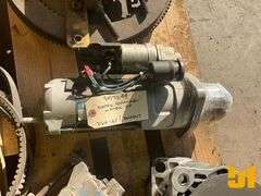 PALLET OF MISC PARTS INCLUDING FLYWHEEL, 2 STARTERS, 2 ALTERNATORS,