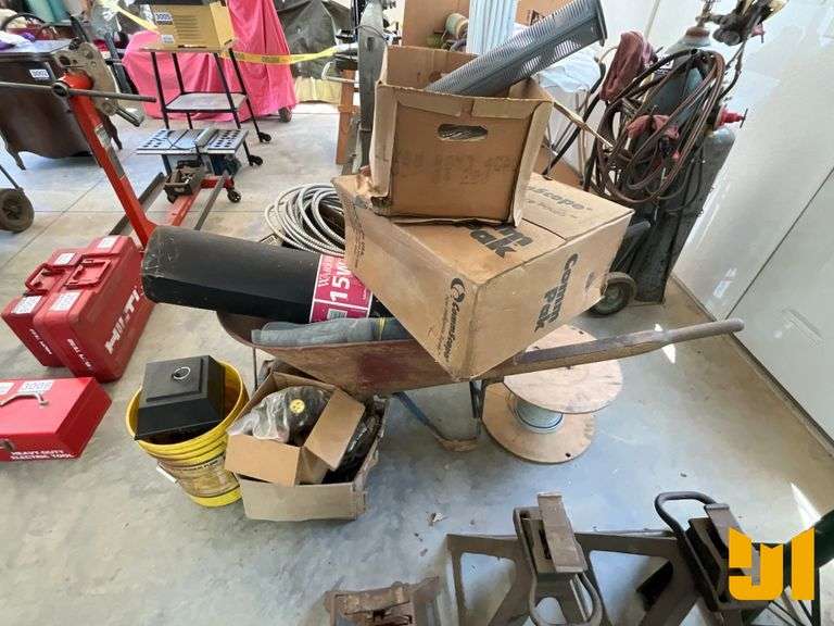 WHEEL BARREL W/ CONTENTS OF ELECTRICAL WIRE & ROOFING FELT