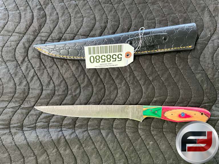 HANDMADE DAMASCUS STEEL KNIFE MEASURING APPROXIMATELY 13.5 INCHES IN LENGTH.