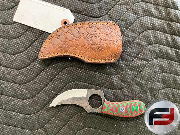 KNIFE FEATURING A MULTICOLOR HANDLE WITH A TEXTURED BLADE, APPROXIMATELY