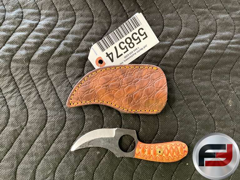 CUSTOM KNIFE FEATURING A DISTINCTIVE BLADE DESIGN AND A CARVED