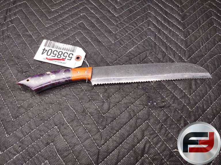 SERRATED BREAD KNIFE FEATURING A BLADE APPROXIMATELY 14 INCHES IN