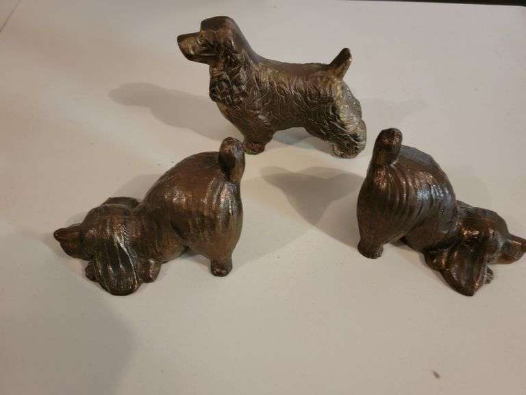 2 dog bookends, and 1 brass dog sculpture