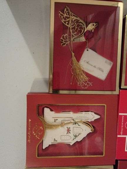 Collection of Lenox Christmas ornaments in the box
