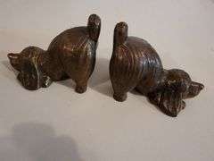 2 dog bookends, and 1 brass dog sculpture