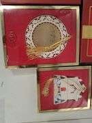 Collection of Lenox Christmas ornaments in the box