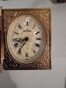 Currency notepads, vintage glasses, small photo desktop clock