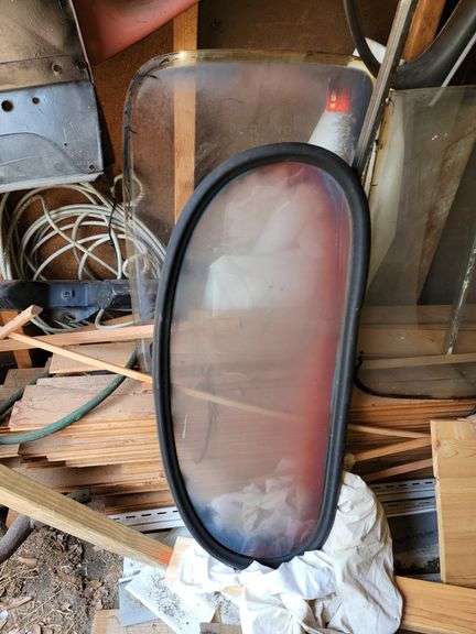 Ford Super Deluxe parts on this wall, steering wheel, windows, parts for restoration