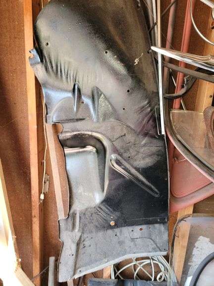 Ford Super Deluxe parts on this wall, steering wheel, windows, parts for restoration