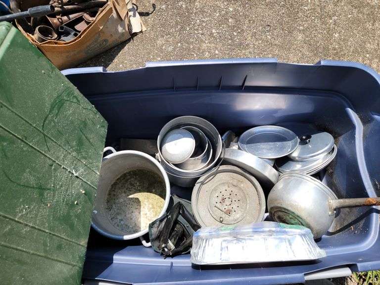 Tote full of camping items, pots, pans, etc