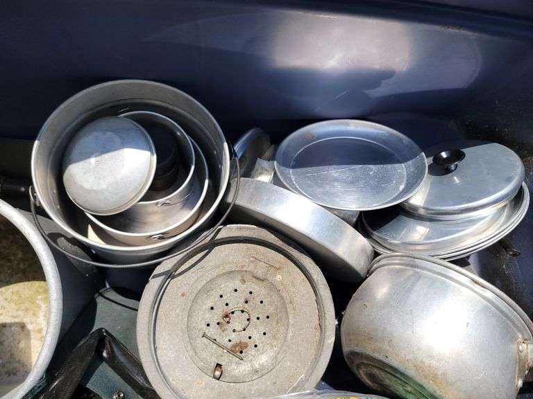 Tote full of camping items, pots, pans, etc