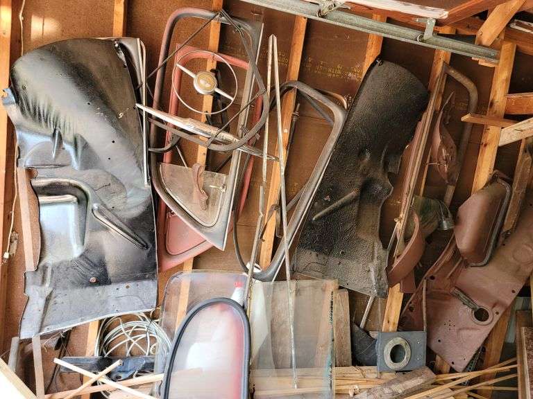 Ford Super Deluxe parts on this wall, steering wheel, windows, parts for restoration