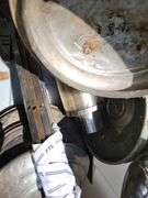 Tote containing hubcaps, hood ornaments, and chrome for Ford Super Deluxe
