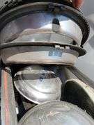 Tote containing hubcaps, hood ornaments, and chrome for Ford Super Deluxe