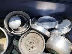 Tote full of camping items, pots, pans, etc