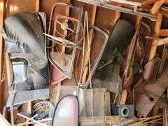Ford Super Deluxe parts on this wall, steering wheel, windows, parts for restoration