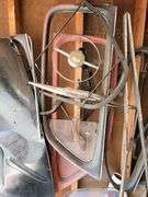Ford Super Deluxe parts on this wall, steering wheel, windows, parts for restoration