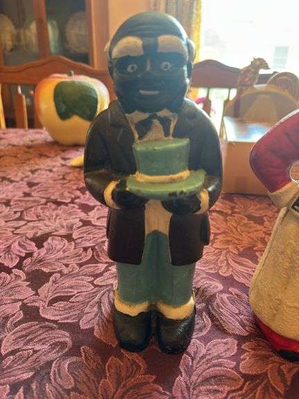 Pair of antique Aunt Jemima coin banks cast iron