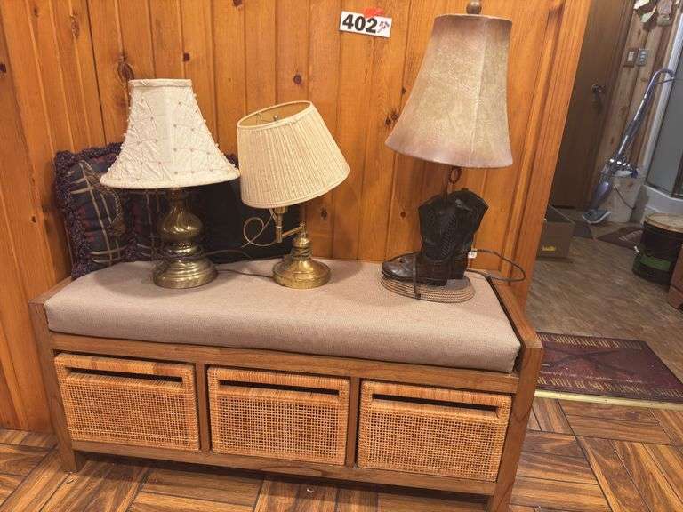 Wood bench with cushion seat, three wicker baskets, three lamps, two throw pillows ￼