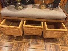 Wood bench with cushion seat, three wicker baskets, three lamps, two throw pillows ￼