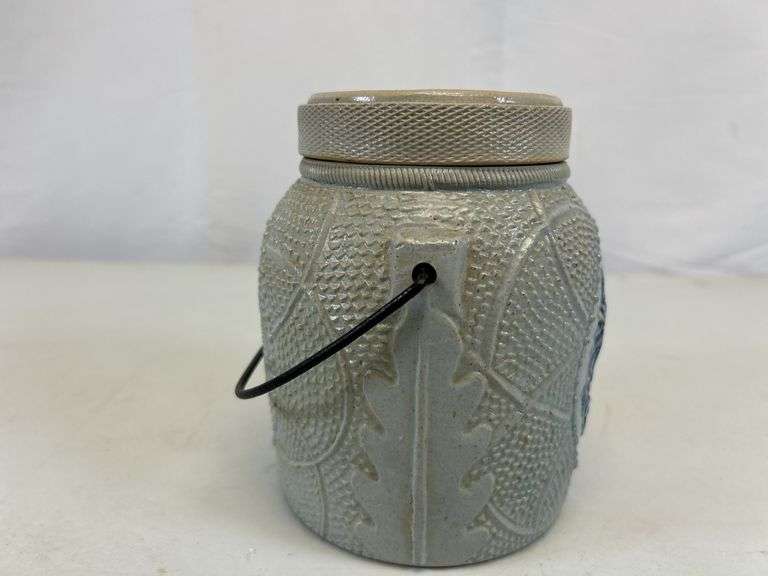 Antique stoneware jar with handle and lid