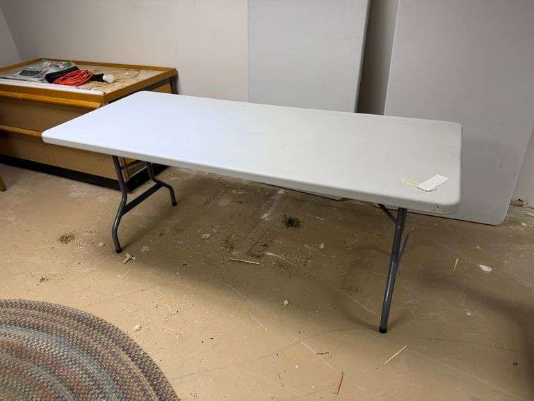 Two plastic folding tables – 6 feet long