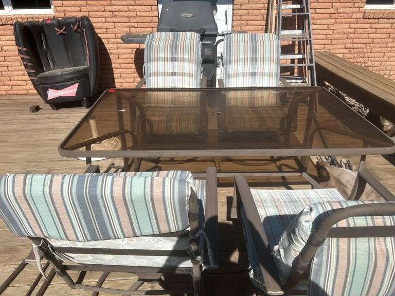Patio table, chairs, and umbrella